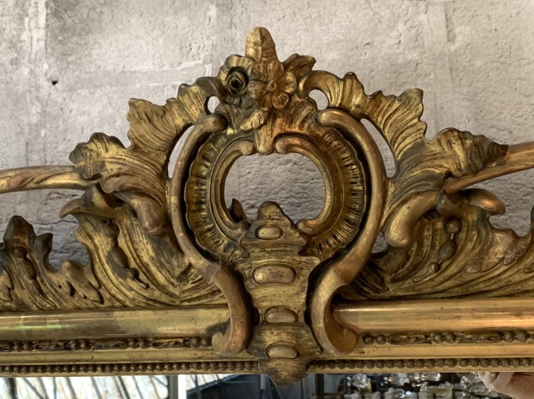 Large gilt mirror with carvings, c. I880